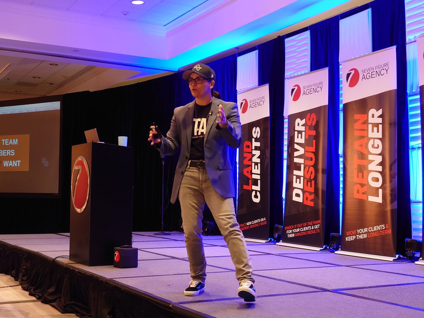 Cris Rodriguez speaking from the Seven Figure Agency stage