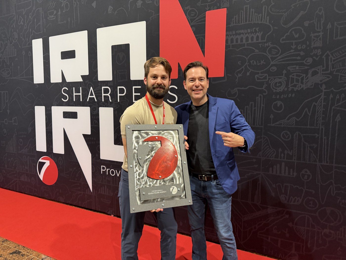 Luke with his Seven Figure Agency plaque alongside Josh Nelson
