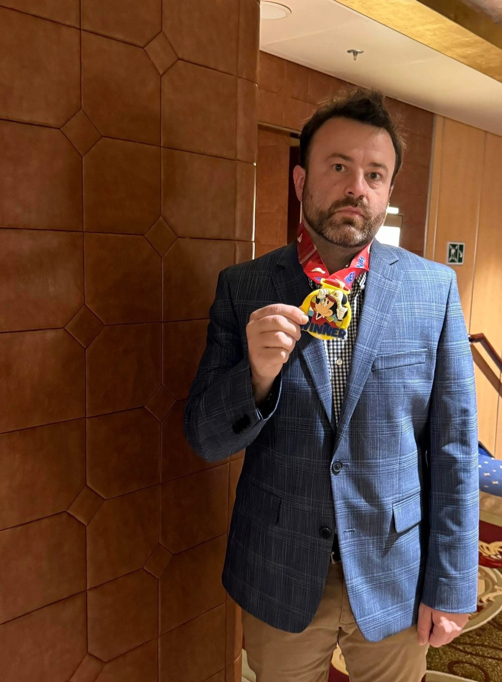 Winner medal in hand at a Seven Figure Agency event